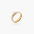 Gold-plated double-band ring with center rhinestone solitaire and channel-set stones on white background