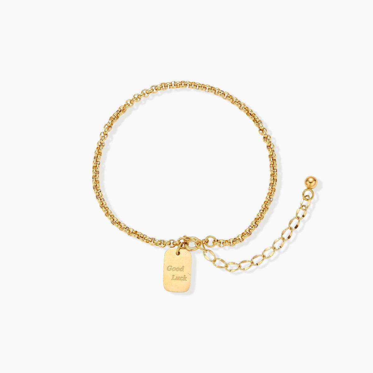 Delicate 18K gold-plated chain bracelet with Good Luck engraved rectangular pendant on cream background