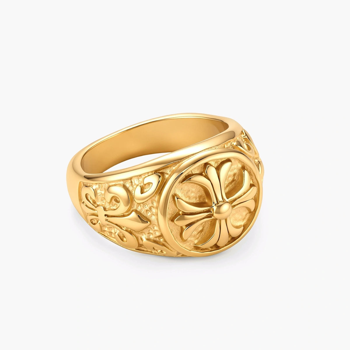 18K gold-plated stainless steel signet ring with ornate cross face and carved filigree scroll band, shown from three angles.