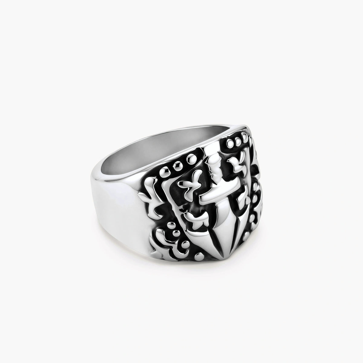 Silver 316L stainless steel men's signet ring with raised knight shield, cross motif, and ornate blackened scrollwork detailing.