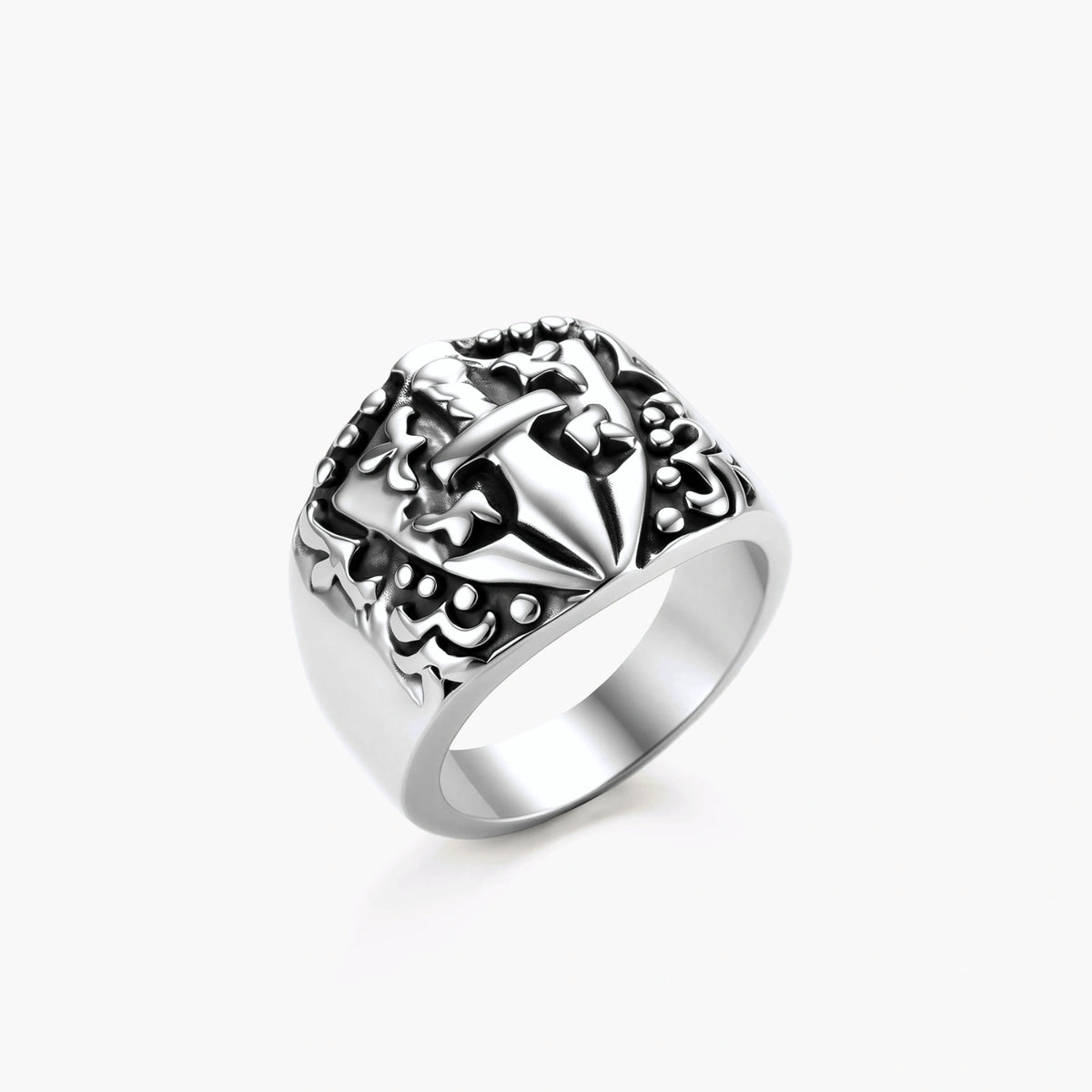 Silver 316L stainless steel men's signet ring with raised knight shield, cross motif, and ornate blackened scrollwork detailing.