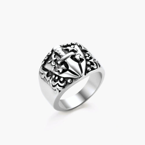 Silver 316L stainless steel men's signet ring with raised knight shield, cross motif, and ornate blackened scrollwork detailing.